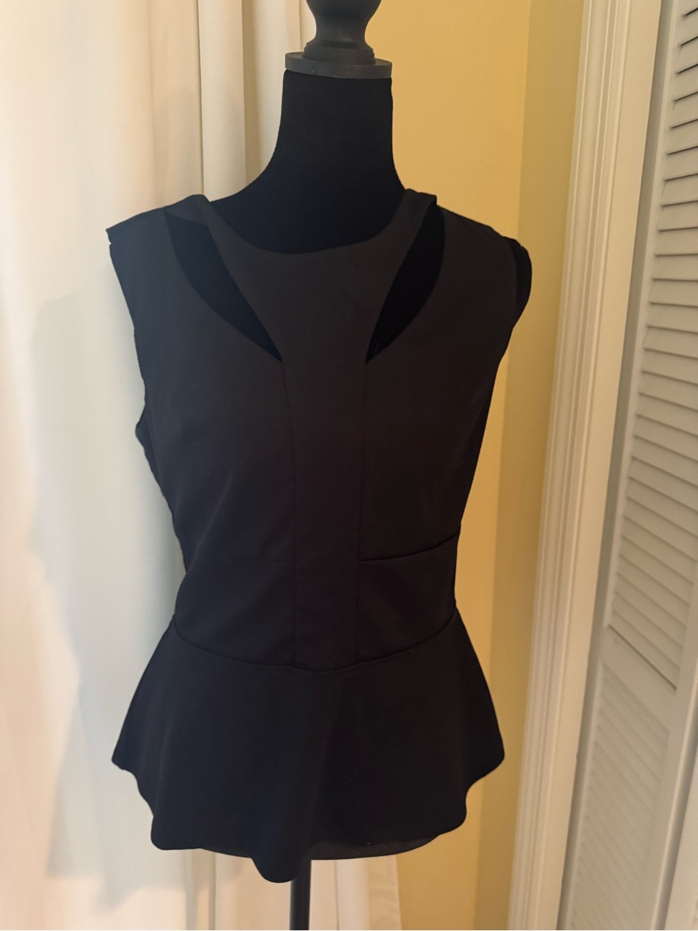 Black Sleeveless Peplum Top